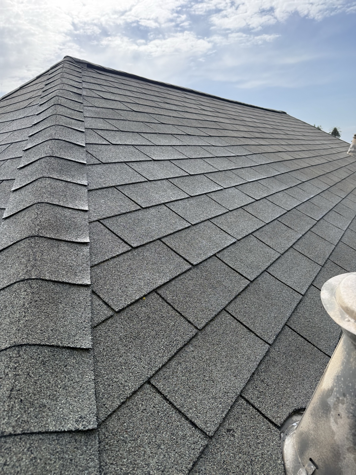 After — Berkeley roof hip ridge with uniform clean shingles after soft wash