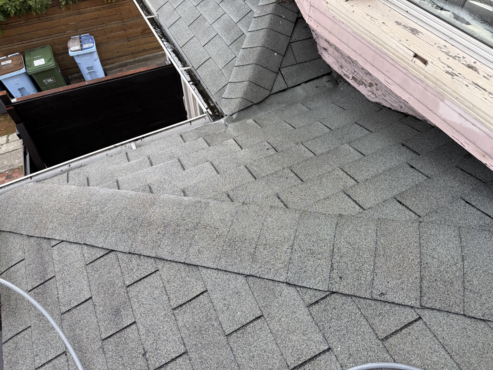 After — washed Berkeley roof planes meeting at a clean valley, debris cleared from the gutter line