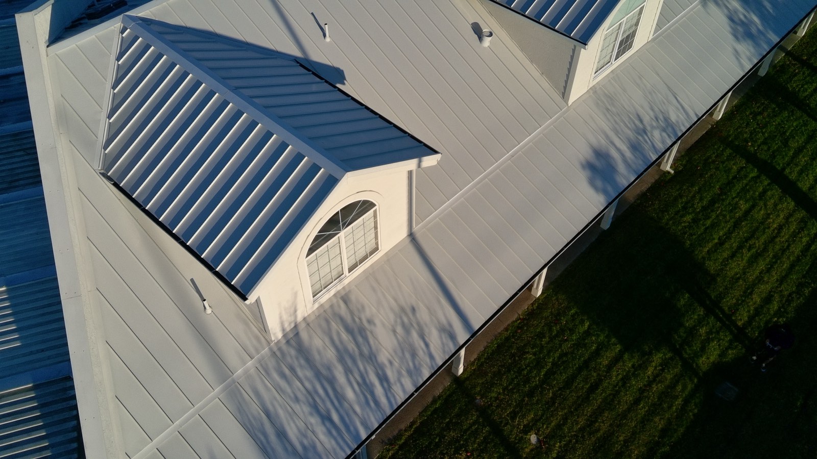 After — Fremont standing seam roof and building wash complete