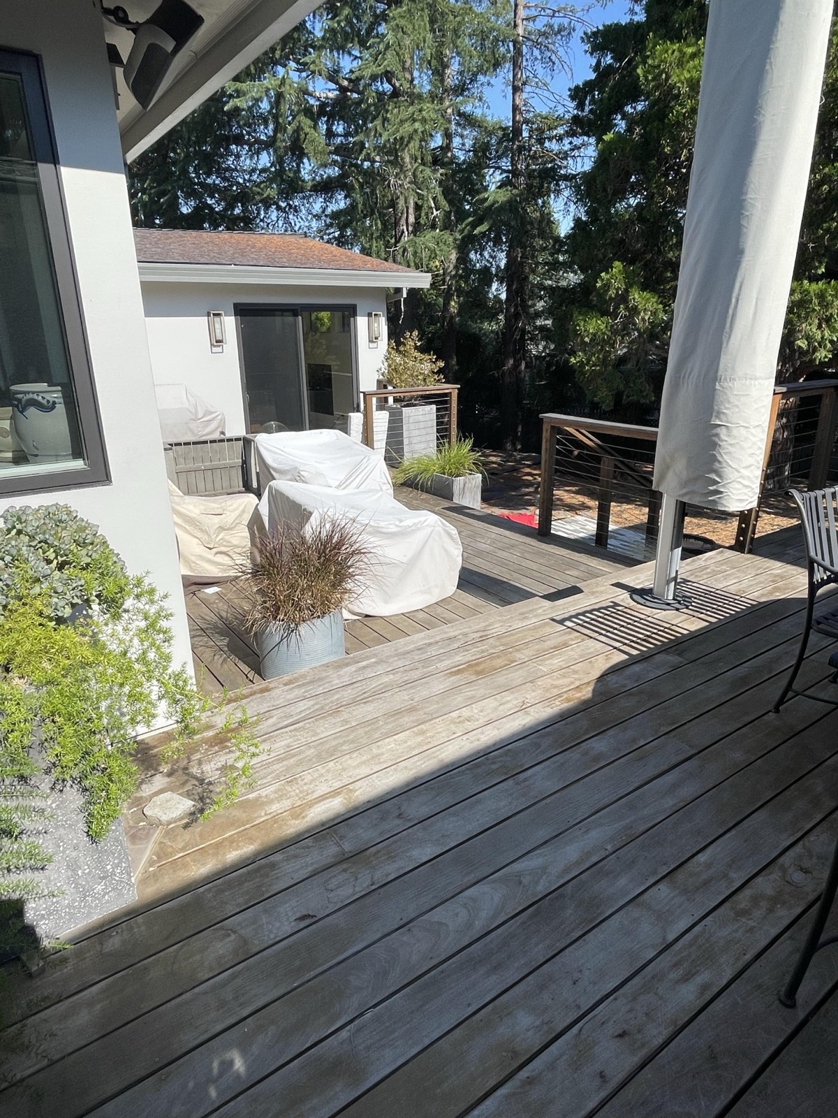 Before — Los Gatos ipe deck heavily greyed from UV oxidation