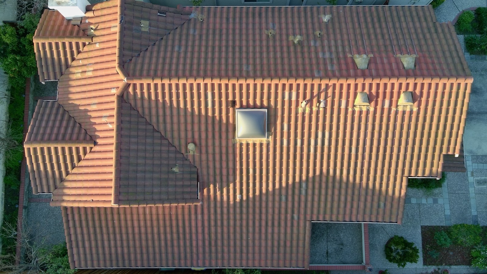 Before — Milpitas townhouse S-tile roof close-up showing dark algae staining