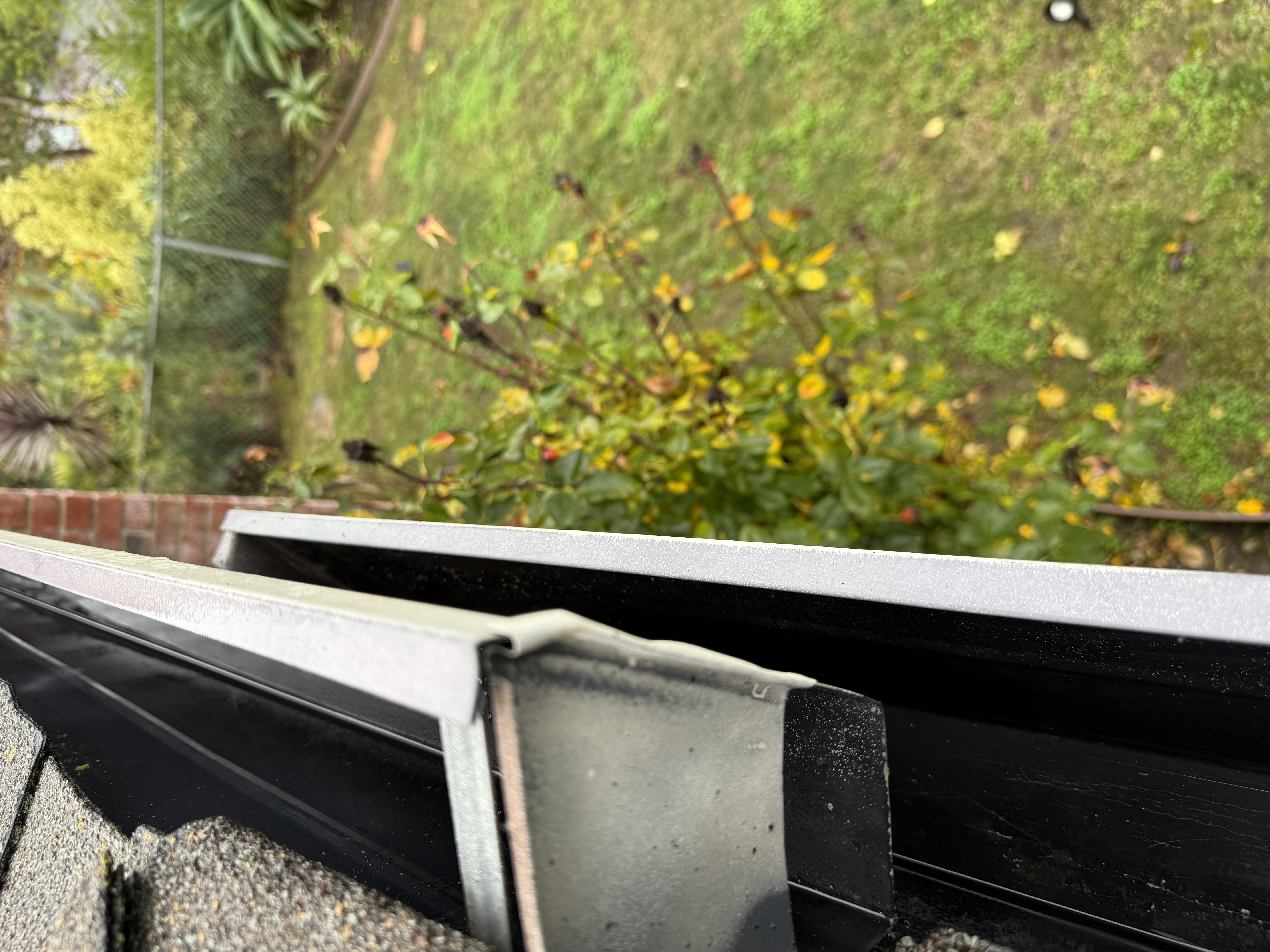 After — Oakland Hills gutter run cleared, downspouts flushed